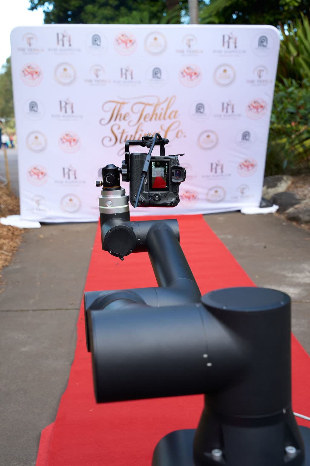 Glambot robotic camera arm on a red carpet at a Tehila Styling Co event